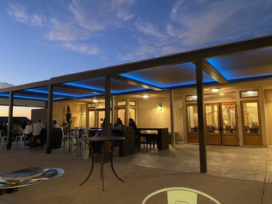 Outside dining area with cool top lighting