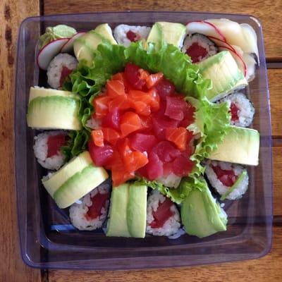 Sushi platter. California roll, tuna roll, and chopped salmon and tuna.