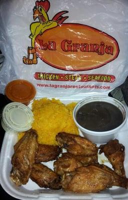 Delicious!  Chicken wings w/yellow rice and black beans.