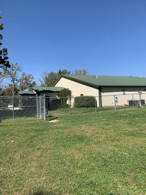 Enclosed dog park overlooking the kennel