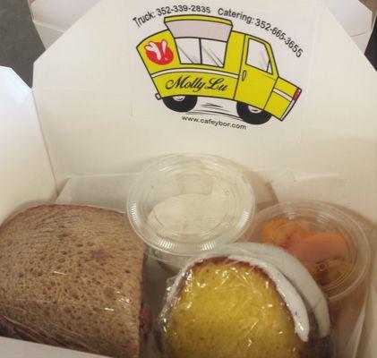 Catered Box Lunches available include a classic deli sandwich, slice of lemon cake and the featured side.