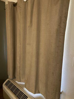 Curtain was dirty with cigarette burn hole.