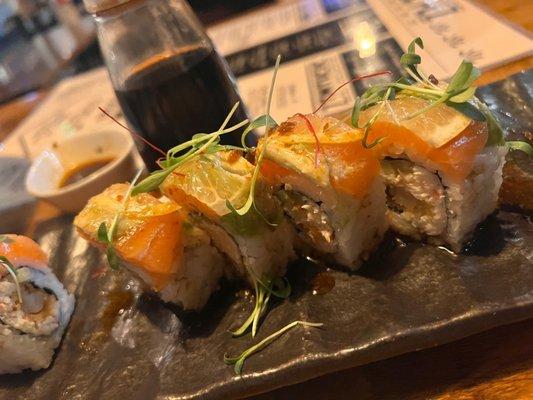 LAURA'S ROLL: Salmon, Shrimp, Crab, Avocado, Cucumber, Lemon Slices, Chiles Toreados, Ponzu, Cilantro.