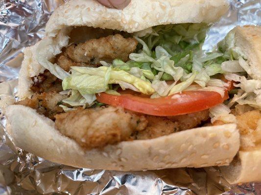 Breaded Calamari sandwich on a soft sesame roll. (Asked for a side of extra tarter sauce)