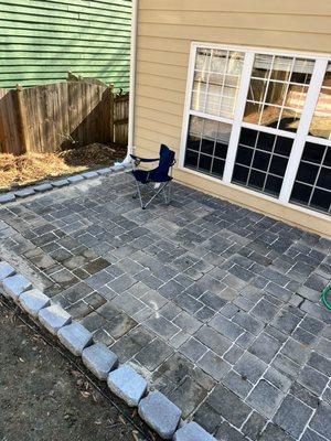 On this particular job, we help the customer re-level his pavers as well as install a gray wall block border. My # 404-786-9655