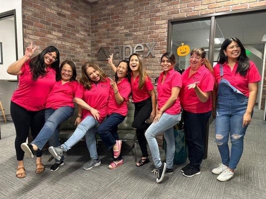 the team decked out in Pink celebrating Breast Cancer Awareness month