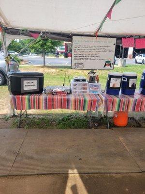 Condiments and drinks stand.