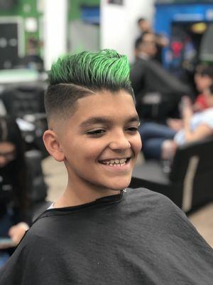 Mid skin fade with scissors on top