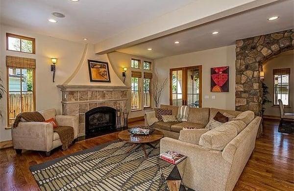 This great room has a custom fireplace and French doors to a private patio.