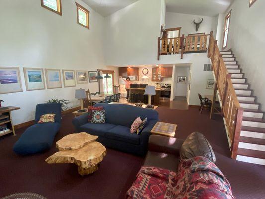 Spacious living/dining room. Two bedrooms and a bath are at the top of the stairs.