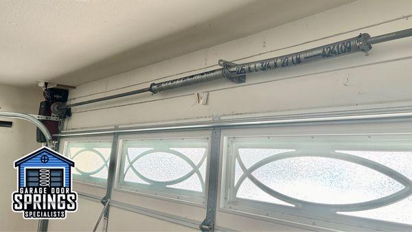 Newly installed garage door springs for smooth and reliable operation. Call us for professional and efficient garage door spring replacement