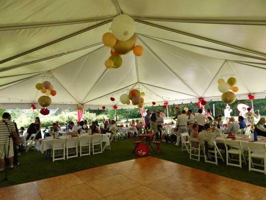 40x40 frame tent; 8 ft. banquet tables with white farmhouse chairs (worth the upgrade!)