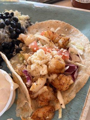 This is the shrimp tacos "blackened" and missing the sauce aka food poisoning