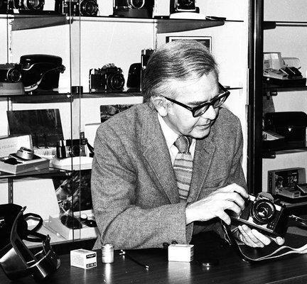 Stan Tracz demonstrating the 'latest' film camera in 1970.