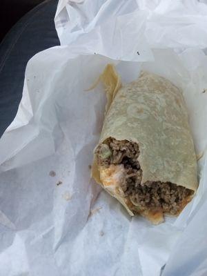 Beef burrito cut in half but tasted