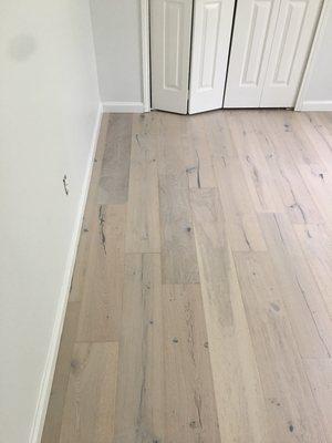 Engineered hardwood floors and baseboard installations.