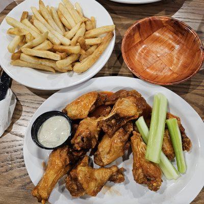 Single order of wings, Hotter level of heat, habanero rub on the fries. And celery pretending to be a vegetable.