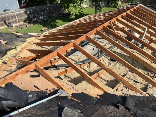 Home roof with rafters exposed