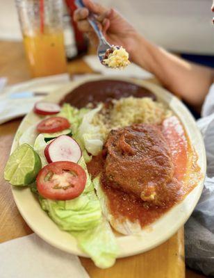 Lengua in salsa de tomate with rice, beans, salad, tortillas