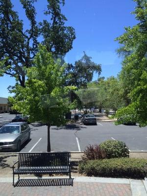 Open parking and bench to sit on.