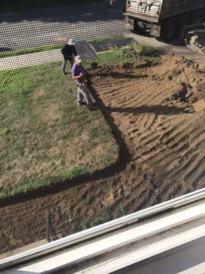 Digging up the old driveway and making it wider