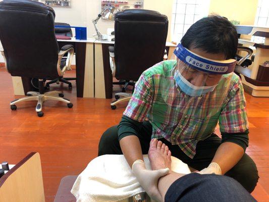 Getting a pedicure from Tung