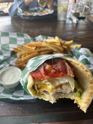 Turkey bacon on a panini bread with fries