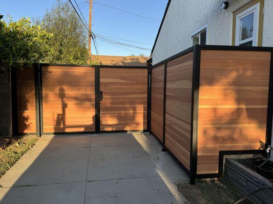 New driveway gates and fence metal frame and wood inserts in Long Beach by OC Gates.