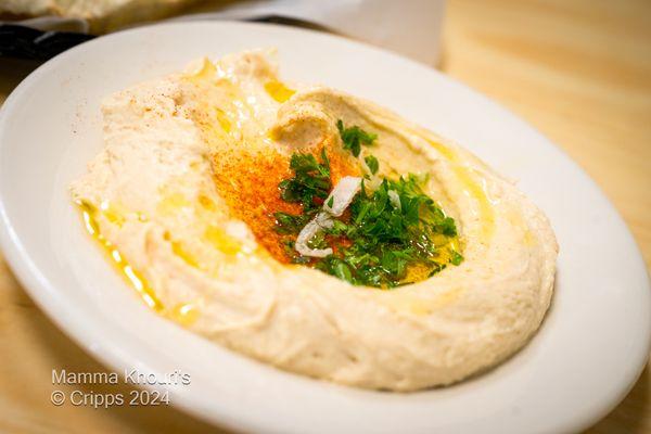 Hummus
 A Thick Creamy Garbanzo Bean Dip Made with, Tahini, Lemon Juice, and Garlic. VGN