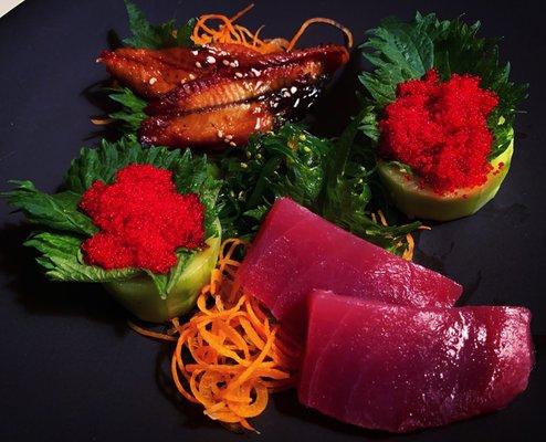 unagi, tobiko, maguro sashimi along with seaweed salad.