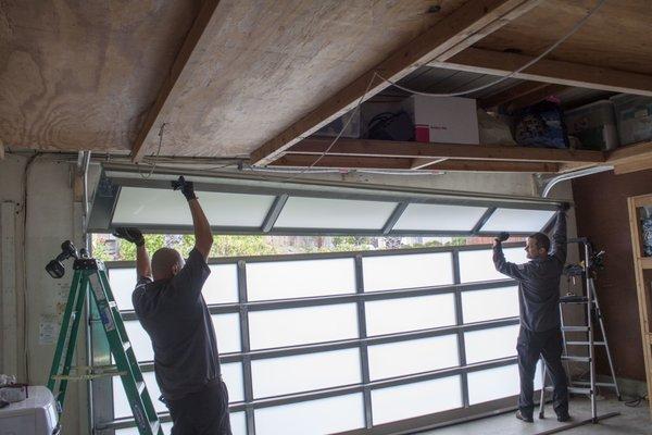 Pedro and Otto installing a Full View Glass Door