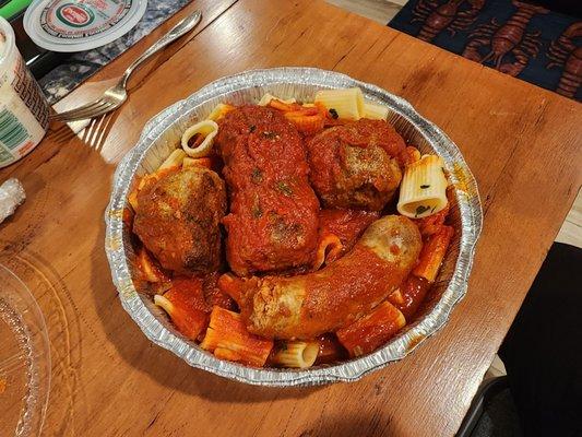 Sunday gravy rigatoni with sausage, meatballs, and brasciole