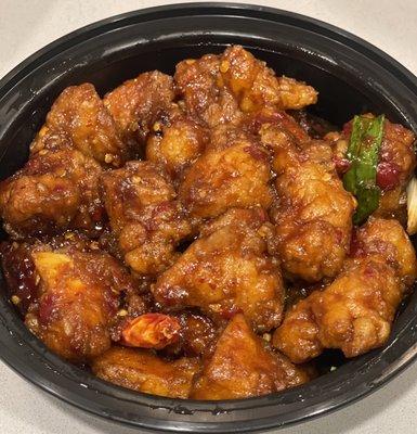 General Tso's Chicken. Not the worst I've had but lacking heat & chicken is dry and stringy. Somewhat sweet...