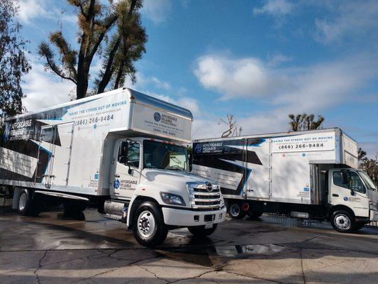 Both trucks wrapped washed and ready to move!