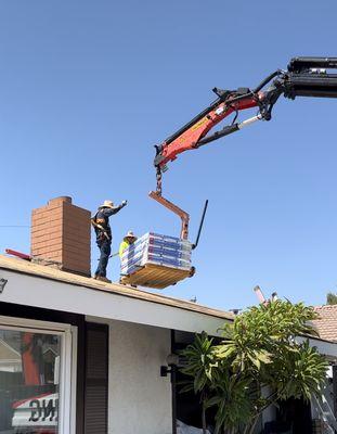 Shingles being delivered to job site.