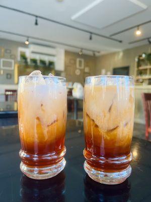 Thai iced tea with milk and oatmilk (on the right)