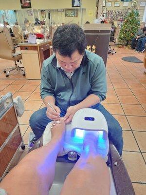 Doing a pedi.