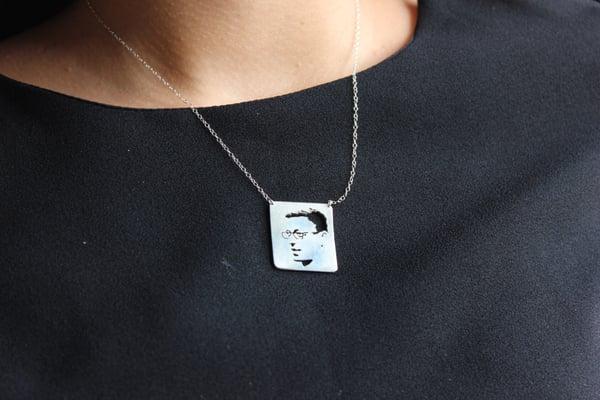 Custom face cut-out necklace I had made for my sister! I sent Jimbob a portrait of my sister's husband, and voila!