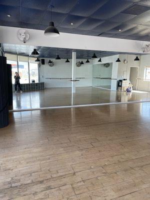 Gorgeous wood floors  and plenty of space to dance and sweat in group classes!