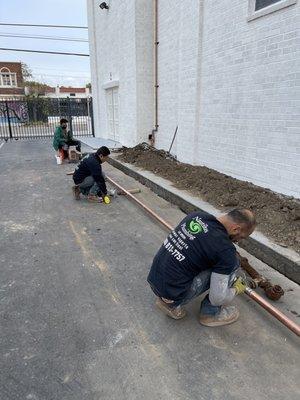 Restoring waterline for two-story, trinity church.