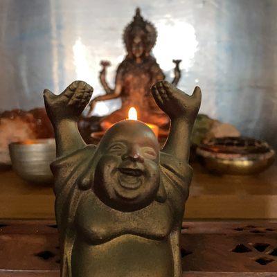 The laughing Buddha photobombed Lakshmi!  Rude.