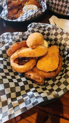 Chicken fingers and burnt onion rings, chicken wings, nachos and  Pierogies