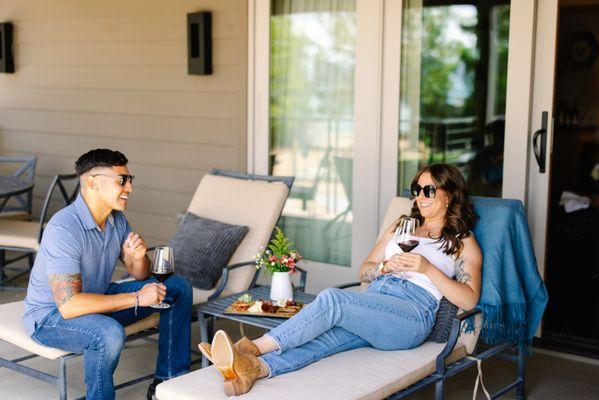 Couple enjoying wine on their private balcony