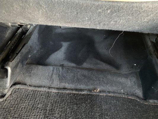 Underneath the passenger seat, after I started to vacuum.