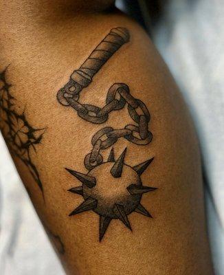 Black and gray mace tattoo by Ashley.