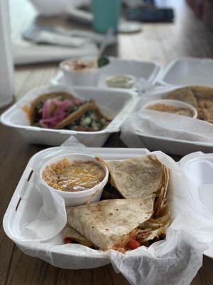 Carne Asada quesadilla with rice and beans. They back it with asada, cheese, pepper and onions. It was so good!