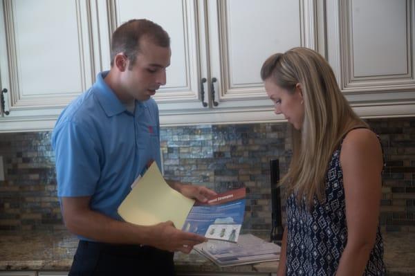 Justin reviewing safety information with homeowner.