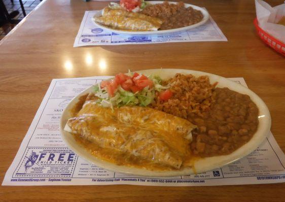 2 wet burritos rice and beans with salad.