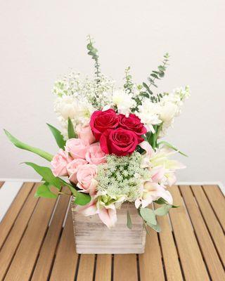 Large flower arrangement that includes 9 roses and tulips perfect to express love to someone.