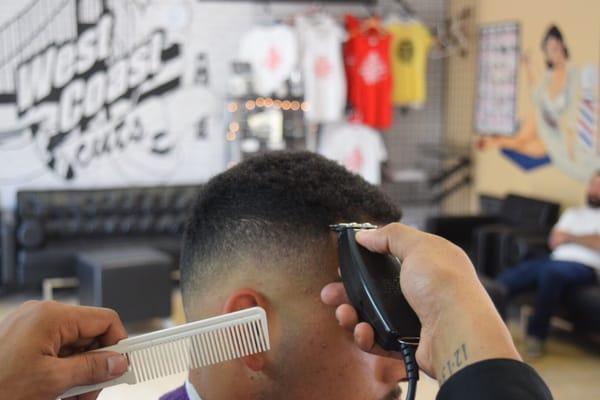 Jerry finishing touches on bald fade